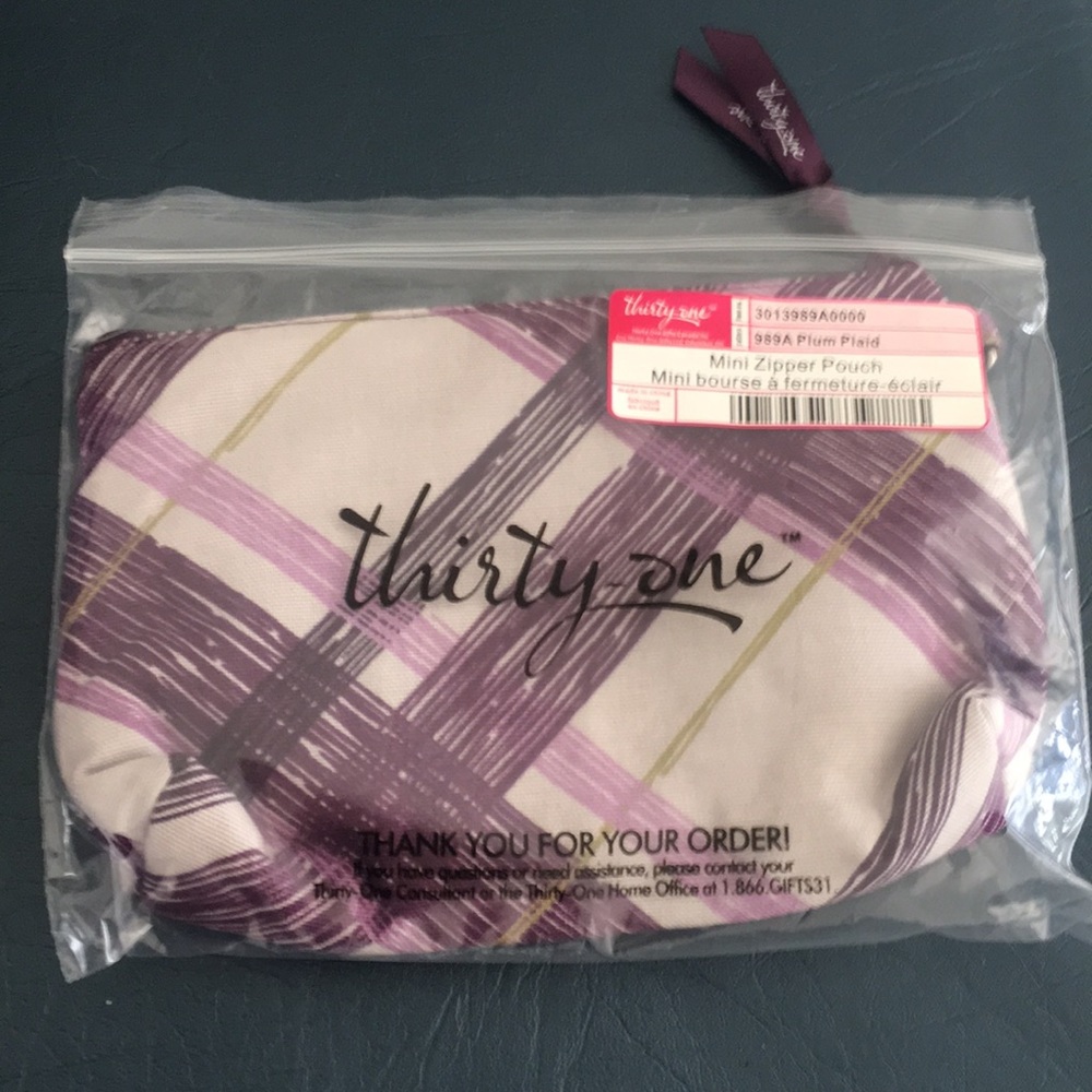 Thirty-one mini zipper purple pouch